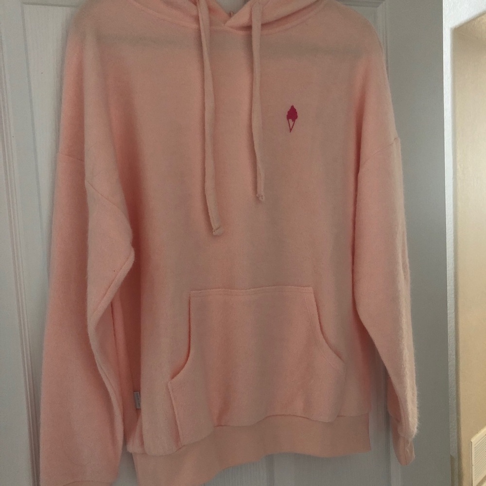 Pink Softserve brand hoodie, size M (company uses men’s sizes)